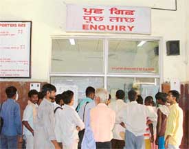 Commuters queue up at the railway enquiry as trains run late due to a strike in Ludhiana on Thursday