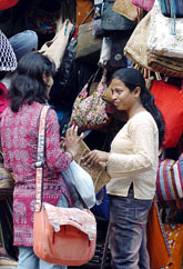Consumers discuss prospective purchases from a stall in New Delhi on Friday. Indias economy expanded by 8.1 per cent in the first quarter of the financial year ending March 2006, thanks to strong industrial growth and roaring consumer demand, official data has revealed.