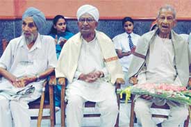 From left: Senior citizens Gurdev Singh Sekhon, Hem Chander and Faqir Chand Shahi being felicitated at a special function at Khukrain Bhavan in Sector 35