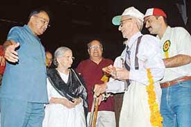 Gen. S.F Rodrigues (retd) honours the oldest member of the Chandigarh Senior Citizens Association, Mr Jamna Das, at the Tagore Theatre in Chandigarh on Saturday. 