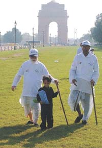 A boy leading two elderly men during a walkathon organised by the Ministry of Social Justice and Empowerment to mark the International Day for Senior Citizens in the Capital on Saturday.