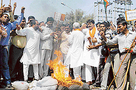 BJP workers protest in Chandigarh on Sunday.