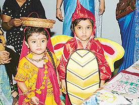 Students of Adharshila school await to perform during a fancy dress competition organised at the school in Panchkula on Saturday.