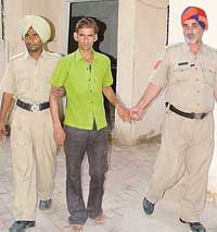 Varinder Kumar, who has been accused of attempting to rape a minor girl in the Kochar Market area, Ludhiana, in police custody on Monday. 