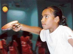 Neha of Chandigarh region during a table tennis match against Neelu of Lucknow region during the National Sports Meet of Kendriya Vidyalayas in Chandigarh