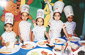 A cooking class in progress for tiny tots of Cherryfield School in Ludhiana on Tuesday.