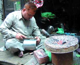 An artisan at work in the Kesarianwala Bazaar in Amritsar