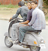 Making a mockery of traffic rules, youngsters enjoy helmetless ride in Chandigarh.
