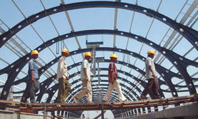 Workers at the metro station in Rajouri Garden.