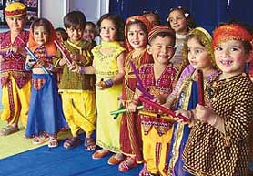 Students of Chanda Mama learn dandia during the Navratra celebrations on the school campus in Ludhiana on Wednesday.