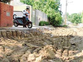 A view of the badly dug-up road.