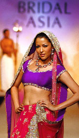 Aditi Gowitrikar displays an outfit designed by a Pakistani fashion designer at Bridal Asia in New Delhi on Thursday.