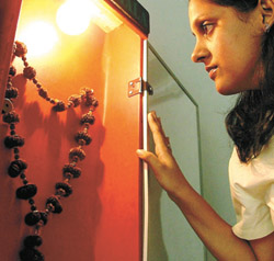 A visitor has a close look at a rare Indra Mala at an exhibition, Rudraksha -The Power Bead, in the Capital on Thursday