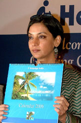 Bollywood film star and social activist Shabana Azmi displays a HelpAge India calendar during its unveiling in New Delhi on Friday.