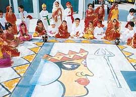 Tiny tots of Shishu Niketan Model Senior Secondary School, Sector 22-D, Chandigarh, celebrate Navratras on the school premises in Chandigarh on Friday.