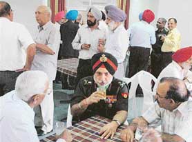 Colonel of the Punjab Regiment, Lieut-Gen Mohinder Singh, interacts with members of the Punjab Regiment Officers Association in Chandigarh on Friday.