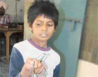 Desh Raj, 11, after being rescued from the custody of his employer in Ludhiana on Saturday