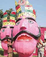 Taking Dusehra celebrations to new heights: Artists give final touches to the giant effigies in Chandigarh on Monday