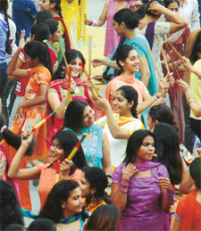 Girls of Khalsa College for Women perform dandia on the college campus in Ludhiana