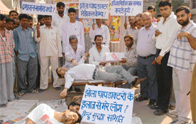 Activists of the Akhil Bhartiya Hindu Suraksha Samiti hold a demonstration demanding action against quacks at Mata Rani Chowk in Ludhiana on Monday
