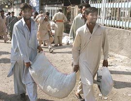 Residents of Muzaffarabad, capital of PoK, loot food items after breaking shops on Monday as no food, water and electricity are available in the city after Saturdays massive earthquake.