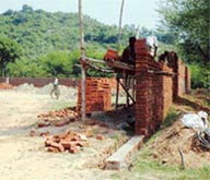 Construction activity in progress on a chunk of land, protected under the forest protection laws, near Perch village; A retaining wall has been raised in a seasonal rivulet, Patiali ki Rao, at Karoran village. The activity is in violation of the Forest Conservation Act.