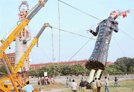 Giant effigies of Meghnath and Ravana being set up in Sector 46, Chandigarh, on Tuesday.