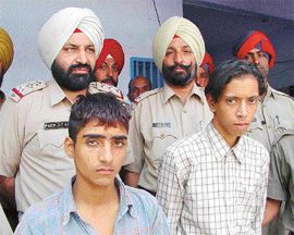 Sucha Singh and Harjant Singh in police custody.