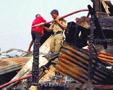Firemen at the scene of the blaze at Bhagirath Place market in the Capital on Tuesday.