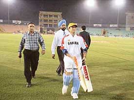 Sachin Tendulkar walks out after the practice session at PCA Stadium, Mohali, on Wednesday.