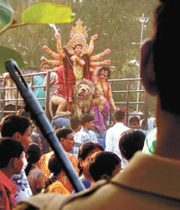 An idol of Goddess Durga on its way to river Yamuna for immersion, marking the end of Durga Puja festivities in the Capital on Wednesday