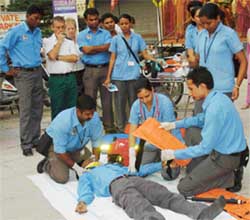 Volunteers give a demo of ambulance, mobike and accident rescue services of the CMCH in a road show in Ludhiana 