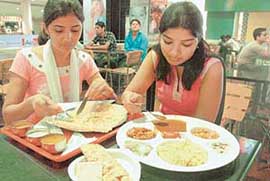 FESTIVE LUNCH: Friends enjoy an afternoon off on Dussehra with a Rawa Dosa and a thali to appease the hunger pangs.