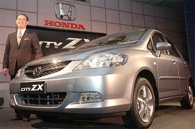 Mr Masahiro Takedagawa, President and CEO, Honda Siel Cars India Ltd, poses at the launch of a new-look City ZX at a press conference in New Delhi