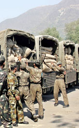 Army men load a truck with relief supplies for the quake-hit in the Badami Bagh cantonment in Srinagar on Thursday.
