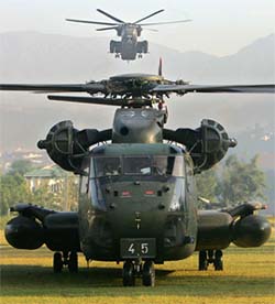 A helicopter belonging to the International Security Assistance Force, based in Afghanistan, arrives in Muzaffarabad for relief operations