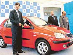 Mr Rajiv Dube (left), Senior Vice-President (Manufacturing and Commercial), Tata Motors, poses with other two officials at the launch of Tata Indica V2 Turbo in New Delhi on Friday.