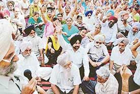 Members of the Mohali Welfare Residents Society protest against the hike in water charges outside the Municipal Corporation office in Phase VII on Friday