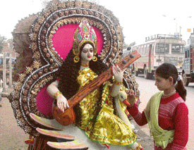 Aruna adds finishing touches to the idol of Goddess Saraswati