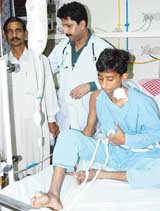 Mohammad Shoaib along with his father Islamuddin after undergoing an open-heart surgery at the PGI in Chandigarh on Saturday