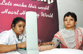 A mediaperson getting her blood pressure checked during a free medical camp organised at the Press Club of India in the Capital on Saturday