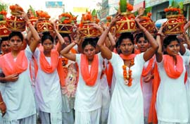 Devotees take part in a procession to mark the birth anniversary of Maharishi Valmiki in Jalandhar on Saturday. 