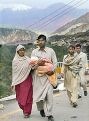 The quake-hit evacuate Muzaffarabad, capital of Pakistan-occupied Kashmir, a week after one of the most devastating quakes hit South Asia in recorded history.