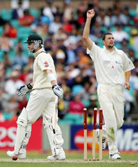 Australias Michael Clarke  walks back after being bowled by Steve Harmison of World XI during the third day of the Super Test in Sydney