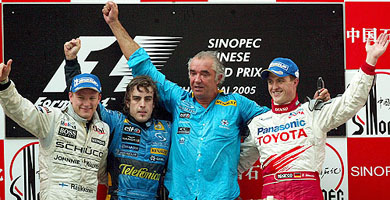 From left: McLaren Formula One driver Kimi Raikkonen, Renaults Fernando Alonso, Renault team managing director Flavio Briatore and Toyotas Ralf Schumacher celebrate on the podium after the Chinese Grand Prix in Shanghai on Sunday