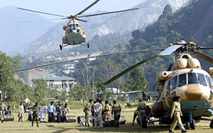 Two Pakistani army MI-17 helicopters land to provide earthquake relief goods in Muzaffarabad