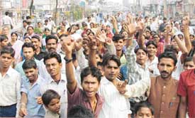 Residents of Mundian Kalan stage a dharna against police inaction in Ludhiana on Monday