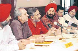 From left: Mr H.S. Bains, Mr S.M.S. Sandhu, Mr G.S. Sandhu, Dr G.S. Kochhar, Mr Sujoy Ganguly of Tiger Sports and Mr G.P.S. Sahi address a press conference at the Chandigarh Golf Club on Monday