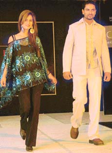 WOMAN ENCOMPASSES MAN: Male models didnt dare to step out on the ramp sans female company and a young hostess takes over the bosss office