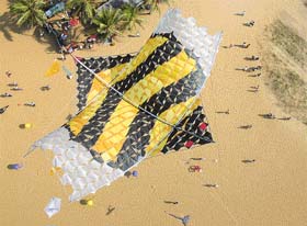 A shot of a kite flying below Nicolas kite